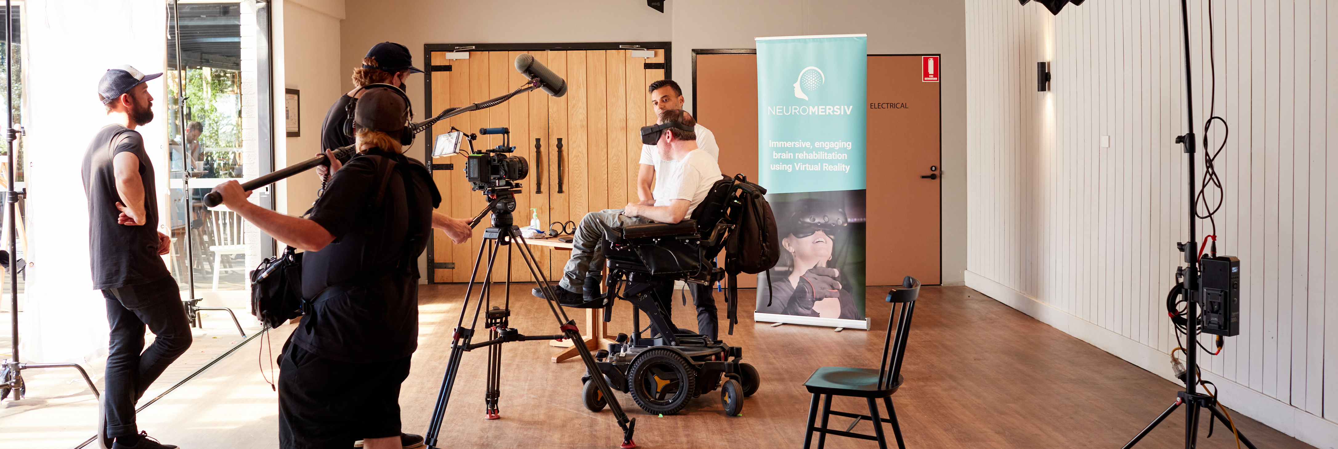 A film crew filming people using assistive technology